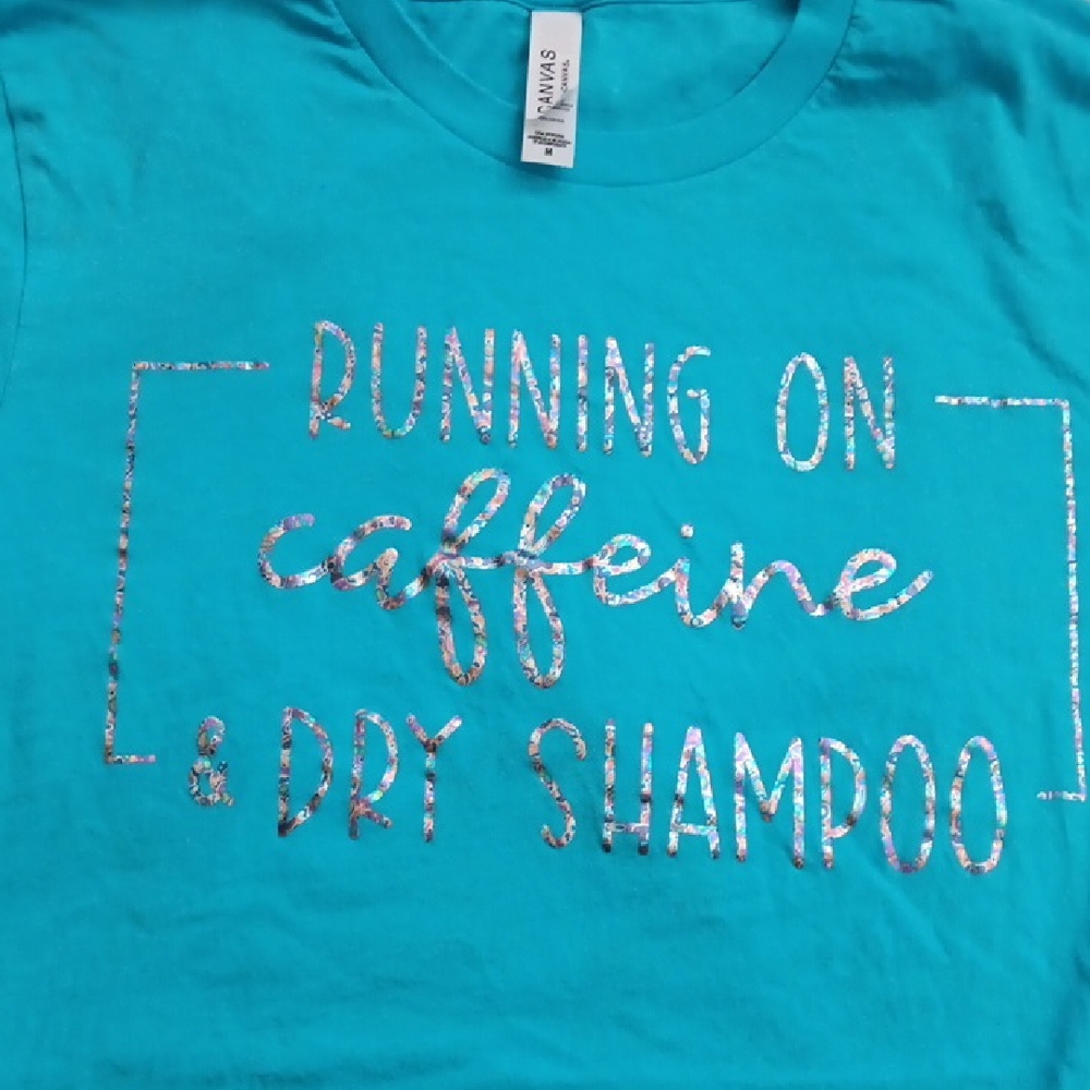 Graphic T-Shirt with Silver Text "Running On Caffeine & Dry Shampoo"